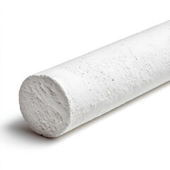 A large stick of white chalk rests on a white background.