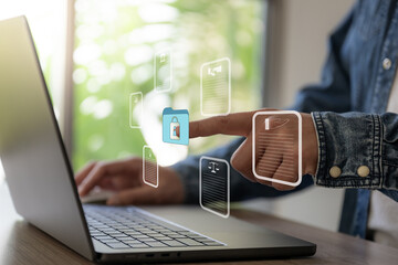 The business man work with laptop seek data folder are locking icon floating on screen