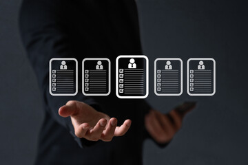 Business man  seek data to find a human data which are floating on screen