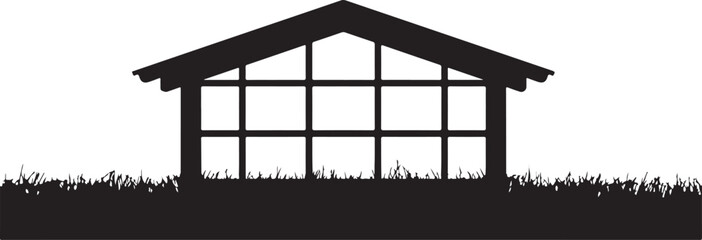 Silhouette of a Small Greenhouse in Grass