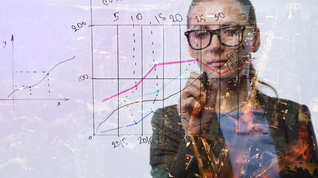 Double exposure of a business woman draws various growth charts