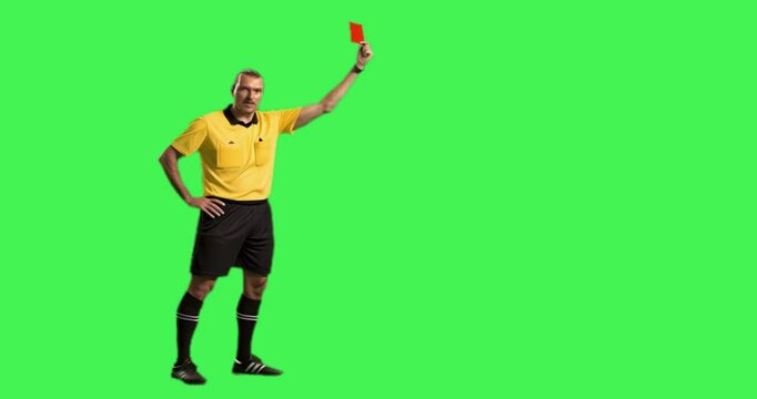  a referee gives a red card in green screen