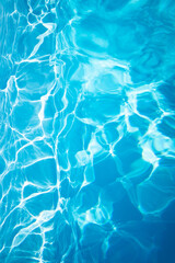 Sunlight creating ripples and reflections on water surface