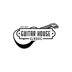 Guitar acoustic and board with guitar house written on it