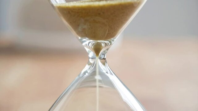 Abstract representation of time passing, the hourglass and the inevitable ticking clock