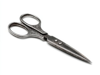 Obraz premium Antique ornate scissors isolated on white background. Silver metal with detailed handle.