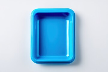 Empty bright blue rectangular plastic container on white background.