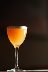 Classic cocktail glass in a nightclub restaurant, close-up