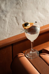 Modern Cocktail with Unique Garnish on a Bar Counter