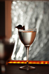Modern Cocktail with Unique Garnish on a Bar Counter