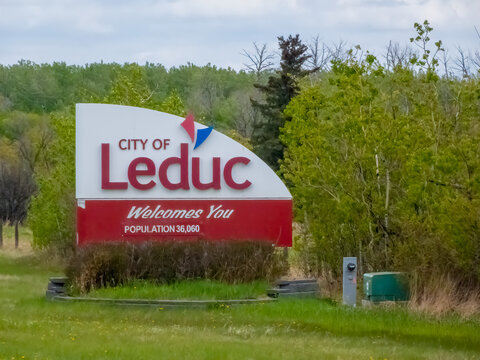 City of Leduc, Alberta, Canada. May 20, 2025. The prominent "City of Leduc Welcomes You" sign stands amidst vibrant greenery, showcasing the city's identity and growing population.