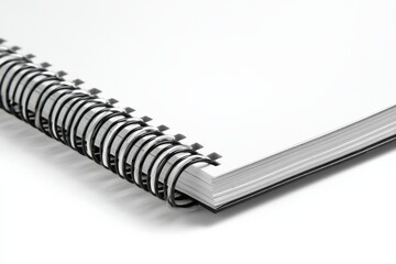 Close-up of a spiral-bound notebook. Blank pages ready for notes or ideas.