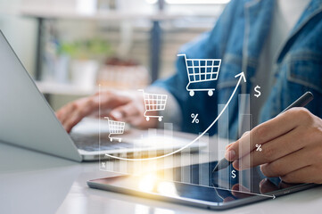 Ecommerce Sales Growth Concept with Graph Overlay Showing Rising Shopping Cart Trend, Businessman Using Digital Tablet and Laptop for Marketing Analytics and Online Retail Strategy at Office