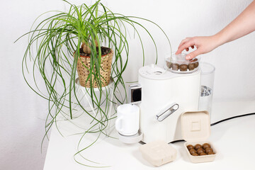 coffee machine with organic capsules in the kitchen