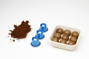 Biodegradable coffee pods vs plastic capsules. sustainability concept
