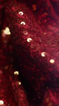 Shimmering red sequin fabric texture in soft light  