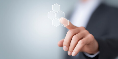 Business professional interacting with digital interface displaying hexagonal shapes and technology concepts for innovation and connectivity concept