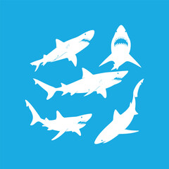 Naklejka premium Silhouettes of Sharks on a Blue Background