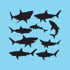 Collection of black shark silhouettes on a blue background