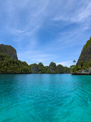 Fototapeta premium Remote lagoon at Wayag island consisting of limestone islands, Raja Ampat, West Papua, Indonesia