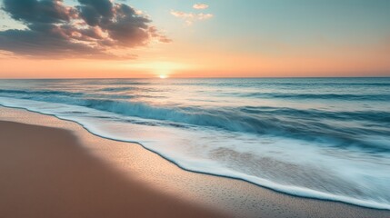 Fototapeta premium Tranquil beach scene at sunset with soft waves and warm, pastel colors.