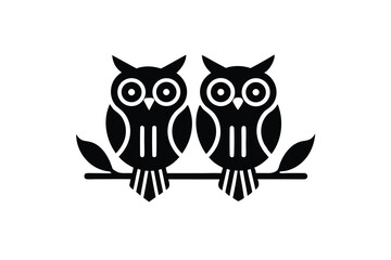 Two adorable owl silhouettes perched on a branch