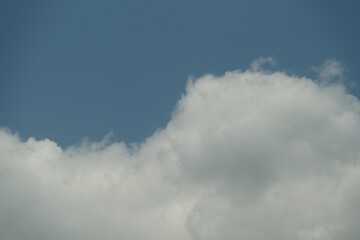 A cloudy sky with a blue sky in the background