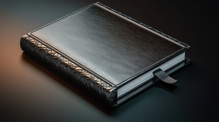 Elegant black leather book with a bookmark resting on a reflective surface.