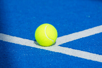 blue paddle tennis court, ball isolated on the line - obrazy, fototapety, plakaty