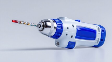 Electric drill with colorful drill bit on a white background, showcasing modern design and functionality for DIY projects