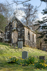 The ruins of St Maol-luags Chapel and the small graveyard surrounding it, an abandoned place of worship with lichen-covered facade and no rooftop, 700 years old church on Isle of Raasay, Scotland, UK