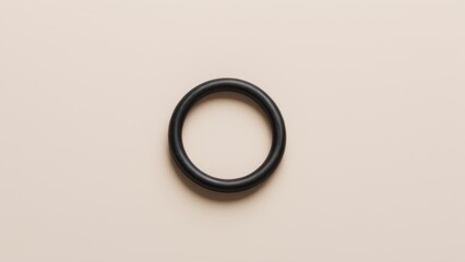 Black rubber o-ring isolated on a white background, ideal for industrial or repair applications.