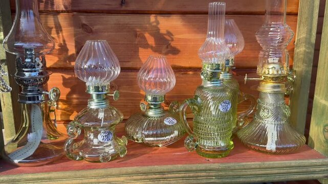Antique Oil Lamps on a Wooden Shelf