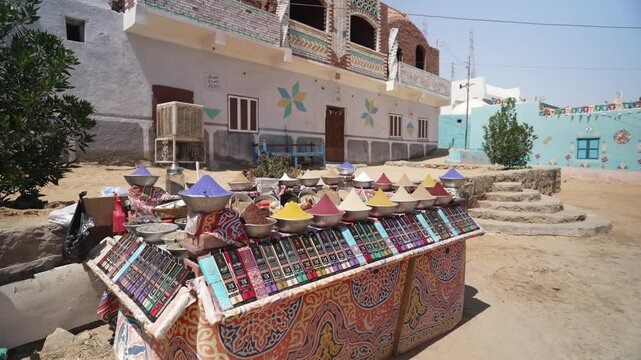 Street view of colourful spice stall in Nubian village on a sunny day, Nagaa Suhayl Gharb, Aswan, Egypt, North Africa, Africa