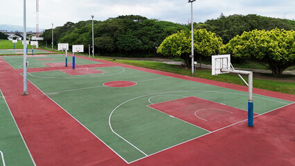 Wide View of Green and Red Basketball Courts