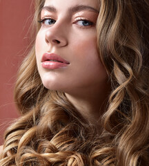 Obraz premium Beautiful woman with magnificent curly hair. professional makeup and hairstyle.