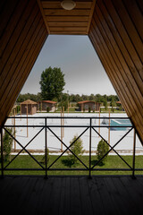 View from the balcony of a wooden house to the recreation area