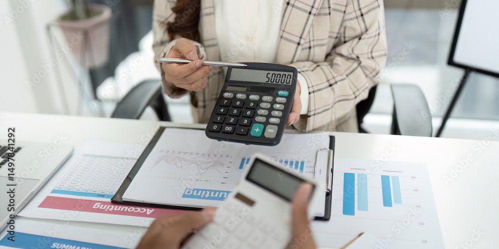Poster financial reporting. accountant showing calculator display with figures during client meeting.