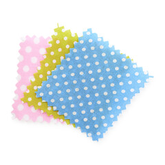 Samples of fabrics with polka dot pattern isolated on white, top view