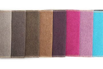Samples of different fabrics isolated on white, top view