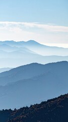 Serene Mountain Vista with Distant Peaks Fading into Hazy Sky