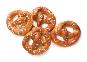 Tasty pretzels with salt isolated on white, top view