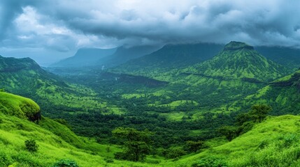 Fototapeta premium Serene Green Mountainscape Under a Cloudy Sky