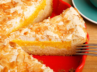 Closeup piece of homemade pie with meringue and orange. Shallow focus.