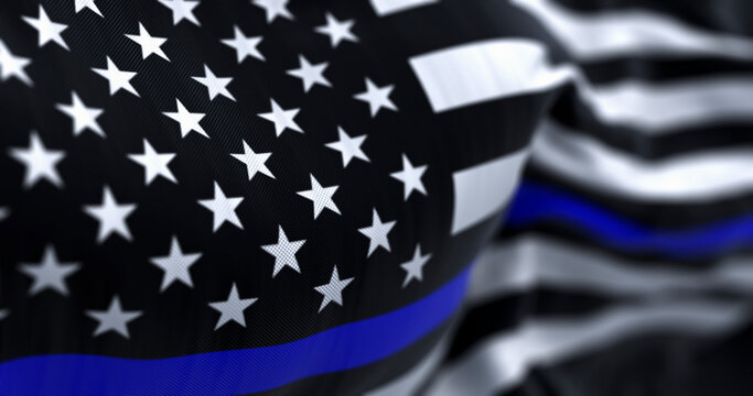 The flag of the United States of America in the Thin Blue Line variant waving in the wind