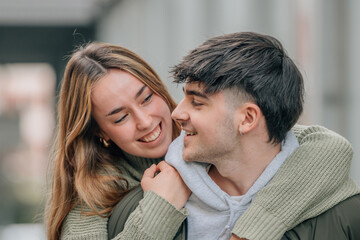 couple having fun with the girl on their backs