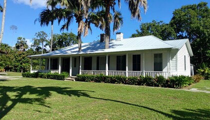 Historical Florida Cracker Farmhouse Surrounded by Tropical Landscape