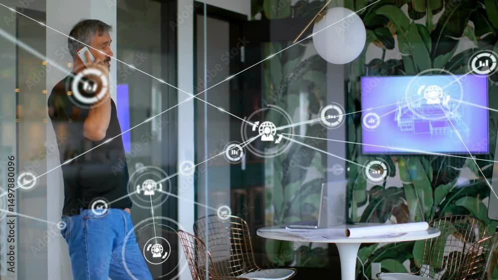 Poster man placing smartphone to ear in it office activating animated network icons linking data to screen