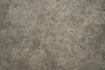 This image presents a textured concrete surface, showcasing intricate patterns and natural imperfections