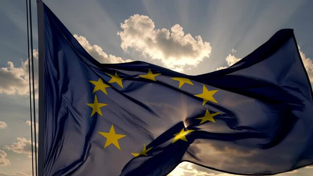 European Union Flag Waving in Wind Close-Up Represents Unity Slow Motion on sky background with sun rays